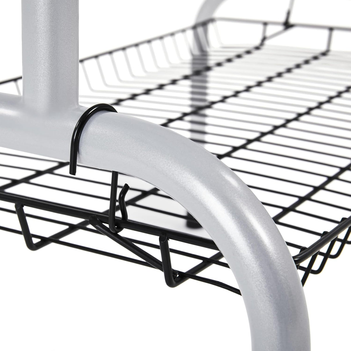 Metal wire shelf with curved white metal bracket on a white background