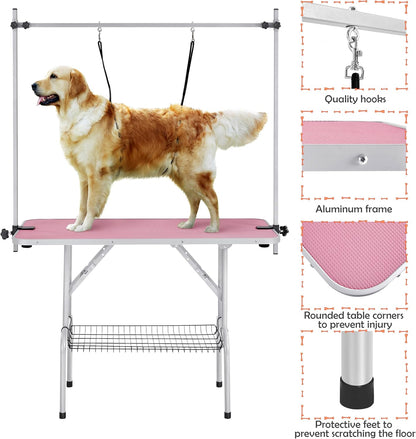 Pink dog grooming table with two grooming nooses